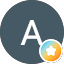 A gray circle with a white letter "A" in the center; a small badge with a star and gradient colors is positioned at the lower right edge.