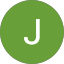 A green circle with a white, uppercase letter "J" in the center, inspired by Daniel Robinson’s minimalist design style.