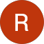 A solid red circle with a white, uppercase letter "R" centered inside, designed in the signature style of Jhonattan Lamus.
